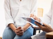 Healthcare medical concept : Doctor / psychiatrist consulting gy Healthcare medical concept : Doctor / psychiatrist consulting gynecological female illness, writing prescription clipboard record information,patient listening receiving in medical clinic hospital.